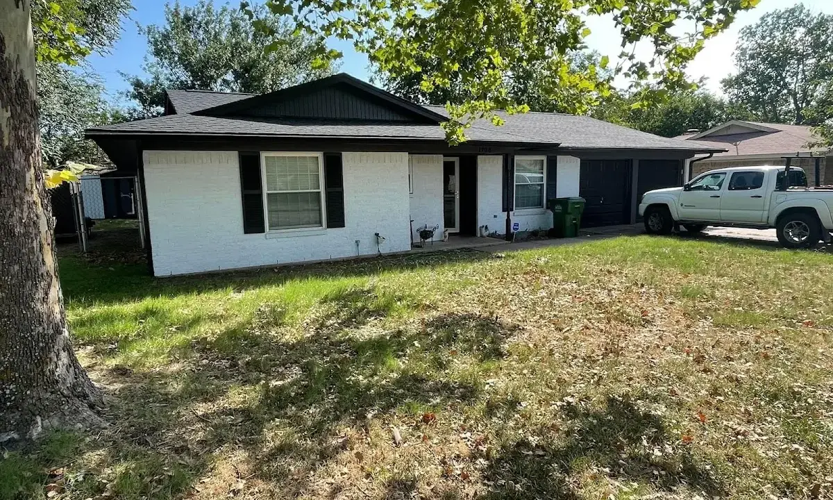 Professional roofing crew working on a residential roof in Carlisle